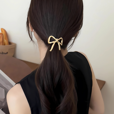 Hair ties with gold and silver metal decoration